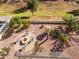 Aerial view of backyard oasis with fire pit at 41999 W Solitare Dr, Maricopa, AZ 85138