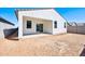 Backyard and covered patio with sliding door at 47771 W Mellen Ln, Maricopa, AZ 85139