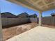 Backyard with privacy walls and concrete patio at 47771 W Mellen Ln, Maricopa, AZ 85139