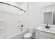 Stylish bathroom features a tub, modern fixtures, and a vanity with white countertops for a clean aesthetic at 47771 W Mellen Ln, Maricopa, AZ 85139