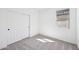 Bright, carpeted bedroom with closet and a window at 47771 W Mellen Ln, Maricopa, AZ 85139