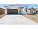 Attractive single-story home featuring desert landscaping and a spacious driveway at 47771 W Mellen Ln, Maricopa, AZ 85139