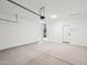 Spacious, bright garage with concrete floors, and an automatic door at 47771 W Mellen Ln, Maricopa, AZ 85139