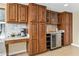 Kitchen features ample wood cabinets and wine cooler at 4901 W Soft Wind Dr, Glendale, AZ 85310