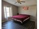 Spacious Primary bedroom with large bed and window at 51989 W Esch Trl, Maricopa, AZ 85139