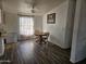 Cozy dining area with wood table and chairs at 51989 W Esch Trl, Maricopa, AZ 85139