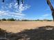 Wide shot of property showcasing expansive land and a mobile home at 51989 W Esch Trl, Maricopa, AZ 85139