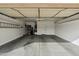 Garage with overhead storage and door at 5296 S Sugarberry Ct, Gilbert, AZ 85298