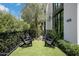 Small, private backyard with artificial turf and seating at 6933 E 1St St # B, Scottsdale, AZ 85251