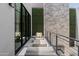 Private balcony with seating and green wall at 6933 E 1St St # B, Scottsdale, AZ 85251