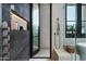 Walk-in shower with modern fixtures and built-in shelving at 6933 E 1St St # B, Scottsdale, AZ 85251