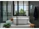 Spa-like bathroom with soaking tub and walk-in shower at 6933 E 1St St # B, Scottsdale, AZ 85251