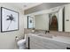 Modern bathroom with floating vanity and large mirror at 6933 E 1St St # B, Scottsdale, AZ 85251