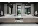 Double vanity bathroom with modern fixtures and marble countertops at 6933 E 1St St # B, Scottsdale, AZ 85251