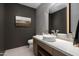 Modern bathroom with floating vanity and dark walls at 6933 E 1St St # B, Scottsdale, AZ 85251