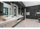 Double vanity bathroom with walk-in shower and marble flooring at 6933 E 1St St # B, Scottsdale, AZ 85251