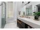 Modern bathroom with a large vanity and walk-in shower at 6933 E 1St St # B, Scottsdale, AZ 85251