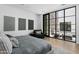 Spacious bedroom with private balcony and large windows at 6933 E 1St St # B, Scottsdale, AZ 85251
