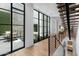Hallway with glass doors and view of private patio at 6933 E 1St St # B, Scottsdale, AZ 85251