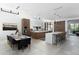 Spacious kitchen with a large island, dining area, and modern cabinetry at 6933 E 1St St # B, Scottsdale, AZ 85251