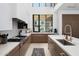 Modern kitchen with island, stainless steel appliances, and marble countertops at 6933 E 1St St # B, Scottsdale, AZ 85251