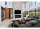 Open living space with a large stone fireplace and high ceilings at 6933 E 1St St # B, Scottsdale, AZ 85251