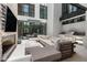 Outdoor patio with seating area, fireplace, and built-in grill at 6933 E 1St St # B, Scottsdale, AZ 85251