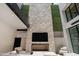 Outdoor patio with fireplace and seating area at 6933 E 1St St # B, Scottsdale, AZ 85251