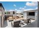 Spacious rooftop deck with seating, fire pit, and city views at 6933 E 1St St # B, Scottsdale, AZ 85251