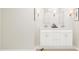 Modern bathroom with double vanity, large mirror, and marble flooring at 7416 S 76Th Ln, Laveen, AZ 85339