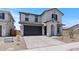 A modern two-story home featuring low maintenance landscaping, a two car garage and stylish shutters at 7416 S 76Th Ln, Laveen, AZ 85339