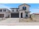 Charming two-story home featuring a two-car garage, landscaped front yard, and stylish architectural details at 7416 S 76Th Ln, Laveen, AZ 85339