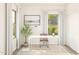 Bright home office with white desk and brown chair at 7416 S 76Th Ln, Laveen, AZ 85339