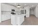 Modern, open kitchen with stainless appliances, a center island and subway tile back splash at 7416 S 76Th Ln, Laveen, AZ 85339