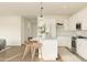Bright kitchen featuring white cabinets and island at 7416 S 76Th Ln, Laveen, AZ 85339