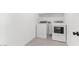 White laundry room with neutral tiled flooring, washer and dryer at 7416 S 76Th Ln, Laveen, AZ 85339
