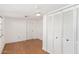 Bright bedroom with wood floors and built-in white closet at 747 E Germann Rd # 67, San Tan Valley, AZ 85140