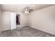 Cozy carpeted bedroom with an adjacent room at 747 E Germann Rd # 67, San Tan Valley, AZ 85140