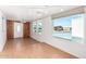Bright dining room with wood-look floors and access to the kitchen at 747 E Germann Rd # 67, San Tan Valley, AZ 85140