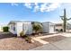 Single-story home with carport and desert landscaping at 747 E Germann Rd # 67, San Tan Valley, AZ 85140