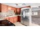 Updated kitchen featuring stainless steel appliances and wood cabinets at 747 E Germann Rd # 67, San Tan Valley, AZ 85140