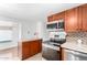 Modern kitchen with stainless steel appliances and wood cabinets at 747 E Germann Rd # 67, San Tan Valley, AZ 85140
