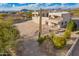 Two-story home with a large backyard and desert landscaping at 8315 E Palm Ln, Mesa, AZ 85207