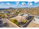 Aerial view showing a two-story house with large backyard in a desert setting at 8315 E Palm Ln, Mesa, AZ 85207