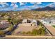 Aerial view of two-story house with desert landscape and mountain views at 8315 E Palm Ln, Mesa, AZ 85207