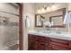 Double vanity bathroom with shower and tile flooring at 8315 E Palm Ln, Mesa, AZ 85207