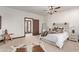 Cozy bedroom with a queen-sized bed and access to balcony at 8315 E Palm Ln, Mesa, AZ 85207