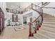 Grand entryway with a sweeping staircase, tile floors, and a chandelier at 8315 E Palm Ln, Mesa, AZ 85207