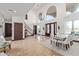 Grand entryway with a sweeping staircase, tile floors, and a chandelier at 8315 E Palm Ln, Mesa, AZ 85207