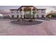 Two-story house with stucco exterior, large windows, and a porte-cochere at 8315 E Palm Ln, Mesa, AZ 85207